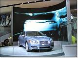  The Jaguar XF Concept, with multi-media barrage behind it.