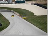  A yahoo with a Honda S2000 invents a new line in turn 14.
The Porsche is not amused.